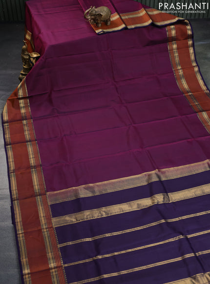 Pure kanchipuram silk saree dark magenta and navy blue with plain body and rettapet long zari woven border