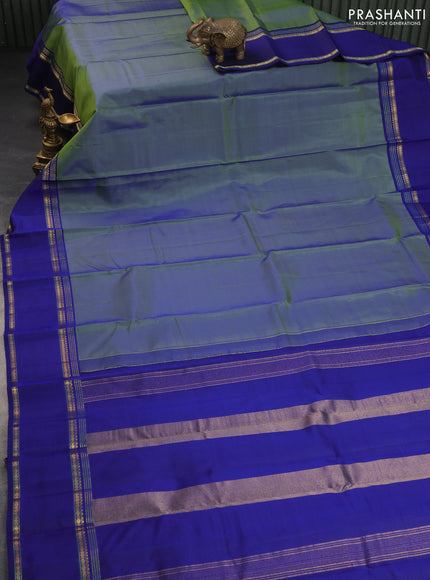 Pure kanchipuram silk saree dual shade of bluish green and blue with plain body and rettapet long zari woven border