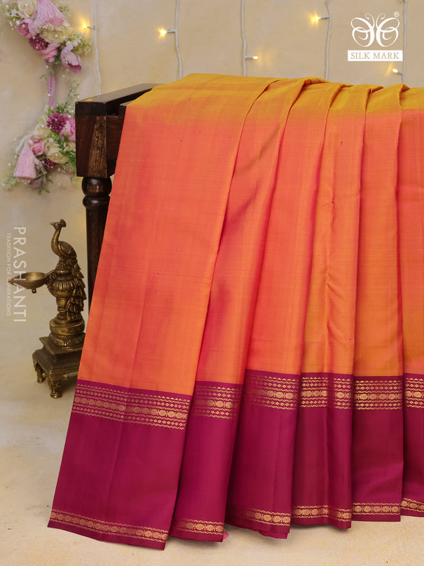 Pure kanchipuram silk saree dual shade of pinkish orange and magenta pink with plain body and rettapet long zari woven border