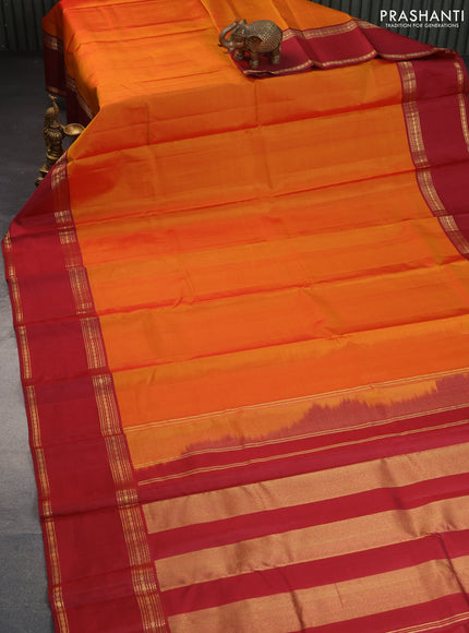 Pure kanchipuram silk saree orange and maroon with plain body and rettapet long zari woven border