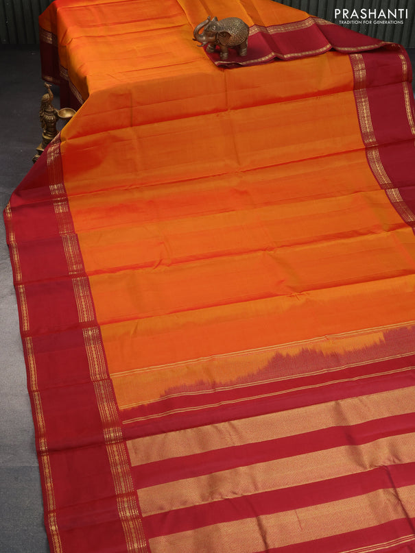 Pure kanchipuram silk saree orange and maroon with plain body and rettapet long zari woven border