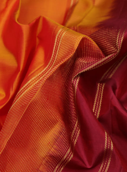 Pure kanchipuram silk saree orange and maroon with plain body and rettapet long zari woven border