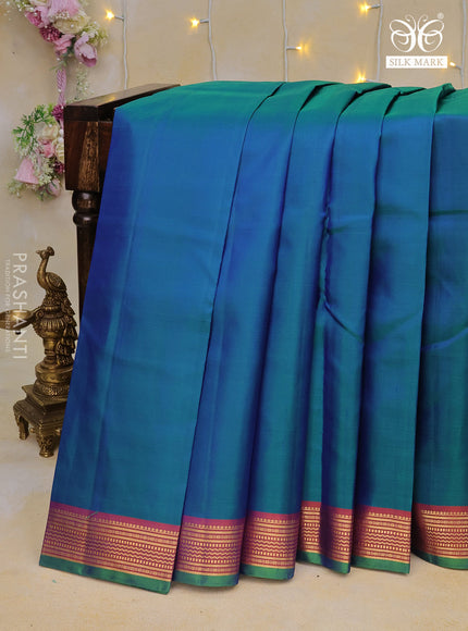 Pure kanchipuram silk saree dual shade of bluish green and dual shade of orange with plain body and zari woven border