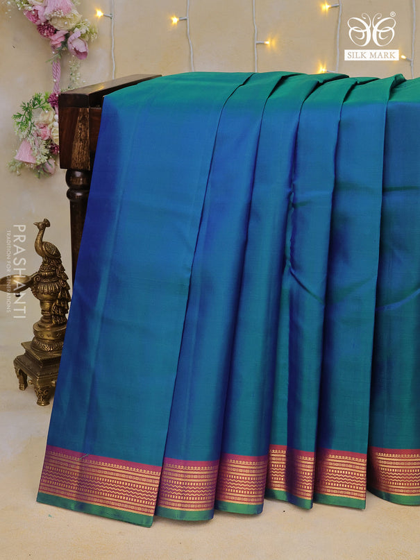 Pure kanchipuram silk saree dual shade of bluish green and dual shade of orange with plain body and zari woven border