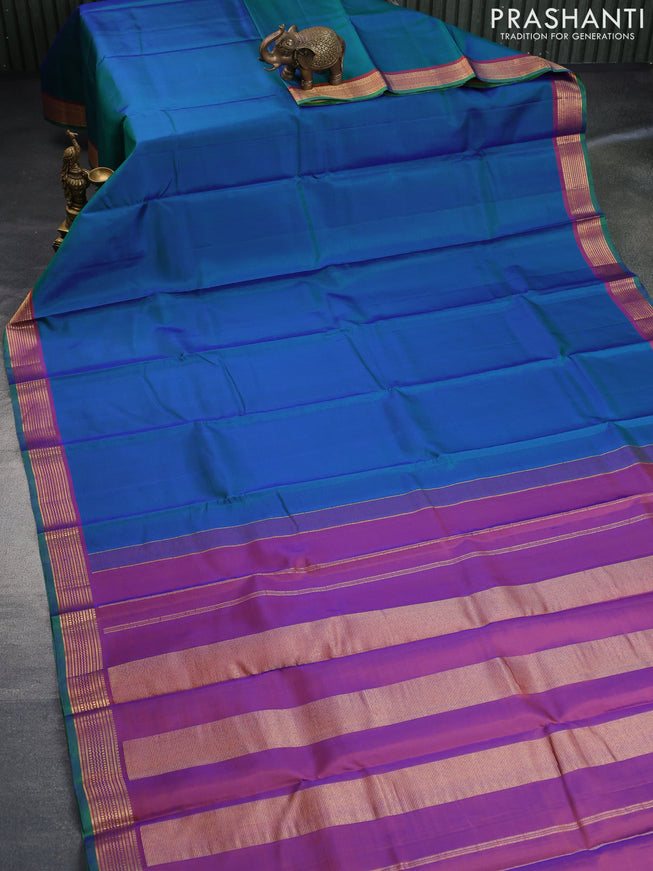 Pure kanchipuram silk saree dual shade of bluish green and dual shade of orange with plain body and zari woven border