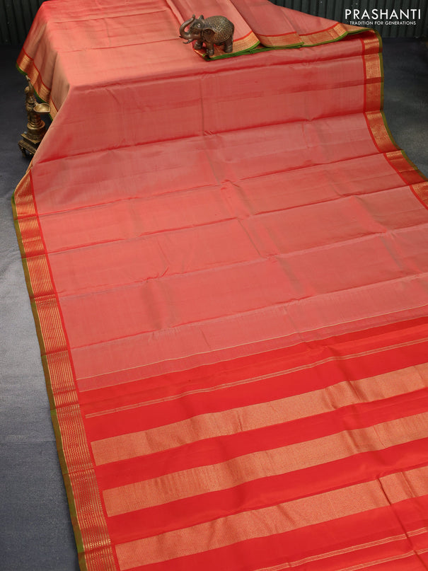 Pure kanchipuram silk saree orange and green with plain body and zari woven border