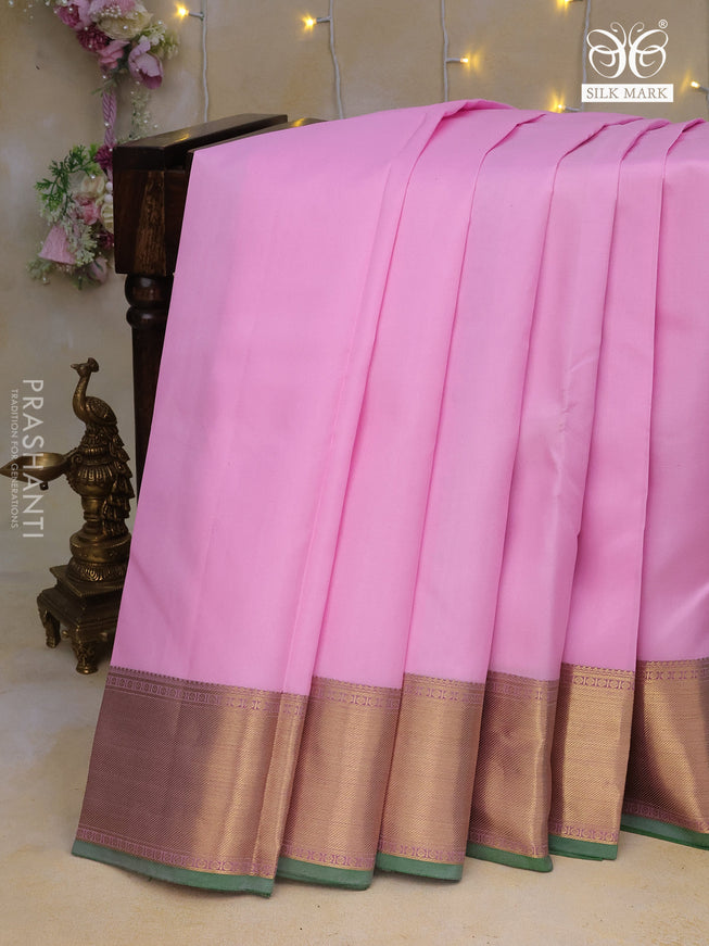 Pure kanchipuram silk saree baby pink and pastel purple with plain body and zari woven border