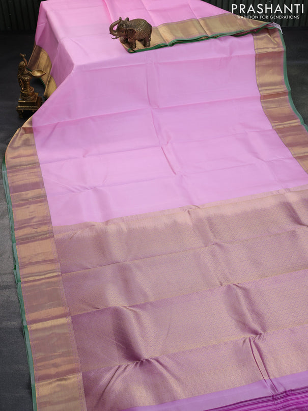 Pure kanchipuram silk saree baby pink and pastel purple with plain body and zari woven border