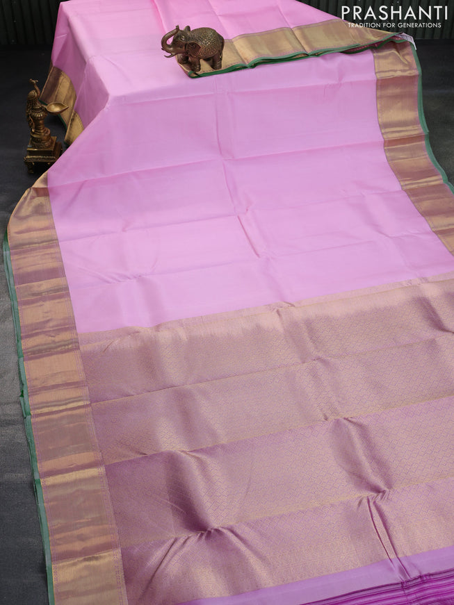 Pure kanchipuram silk saree baby pink and pastel purple with plain body and zari woven border