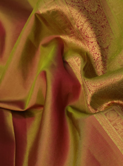 Pure kanchipuram silk saree dual shade of pinkish green with plain body and temple design zari woven border