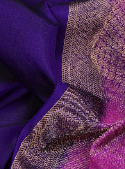 Pure kanchipuram silk saree navy blue and purple with plain body and temple design long zari woven border