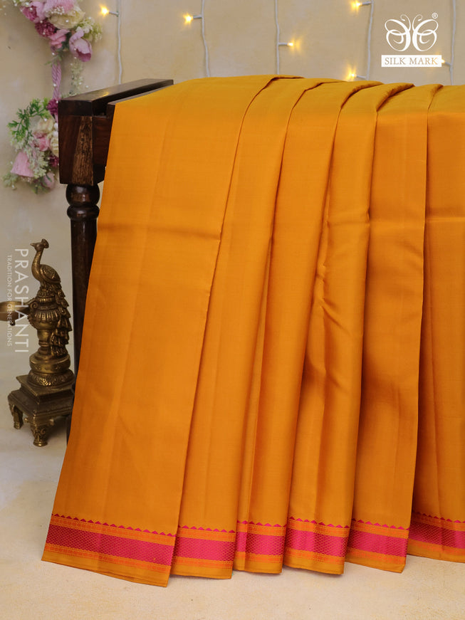 Pure kanchipuram silk saree mustard yellow with plain body and thread woven border