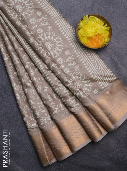 Semi dola saree grey shade with allover warli prints and zari woven border