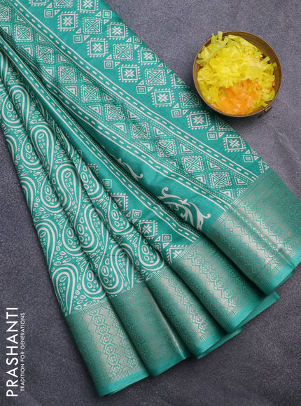 Semi dola saree teal green with allover prints and zari woven border