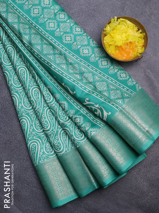 Semi dola saree teal green with allover prints and zari woven border