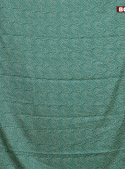 Semi dola saree teal green with allover prints and zari woven border