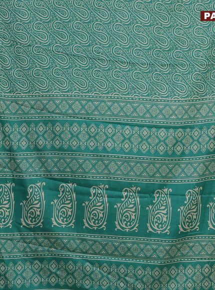 Semi dola saree teal green with allover prints and zari woven border