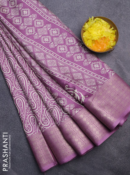 Semi dola saree lavender shade with allover prints and zari woven border