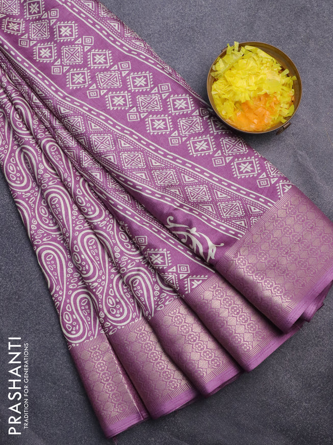 Semi dola saree lavender shade with allover prints and zari woven border