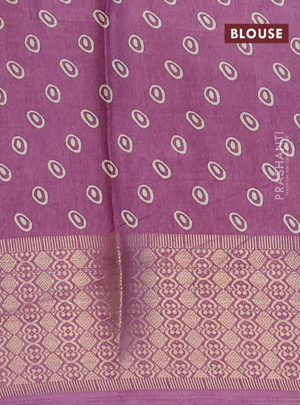 Semi dola saree lavender shade with allover prints and zari woven border