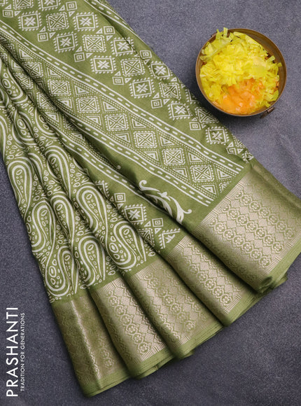 Semi dola saree green with allover prints and zari woven border