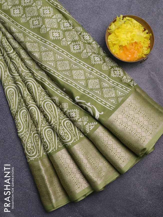 Semi dola saree green with allover prints and zari woven border