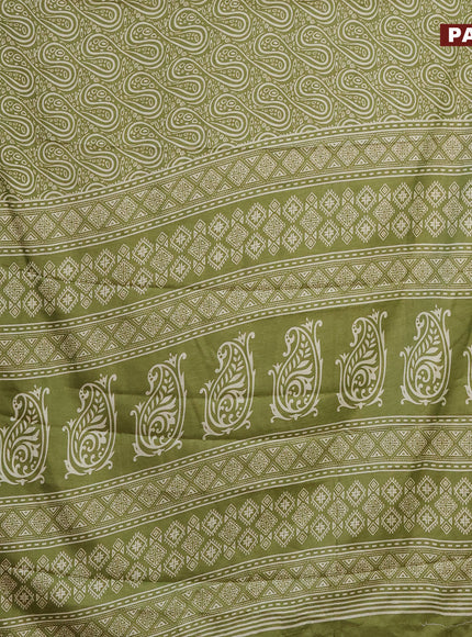 Semi dola saree green with allover prints and zari woven border