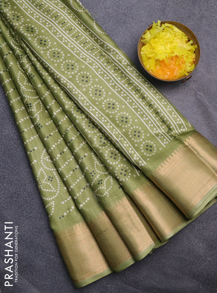 Semi dola saree green with allover prints and zari woven border