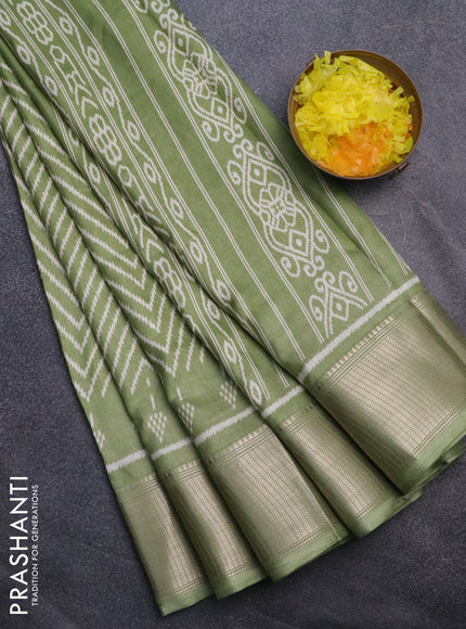 Semi dola saree pastel green with allover zig zag ikat weaves and zari woven border