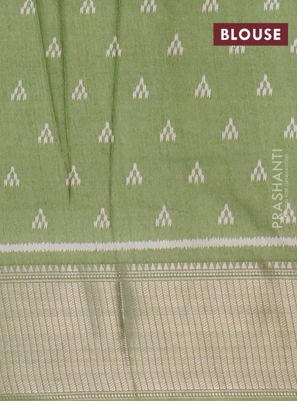 Semi dola saree pastel green with allover zig zag ikat weaves and zari woven border