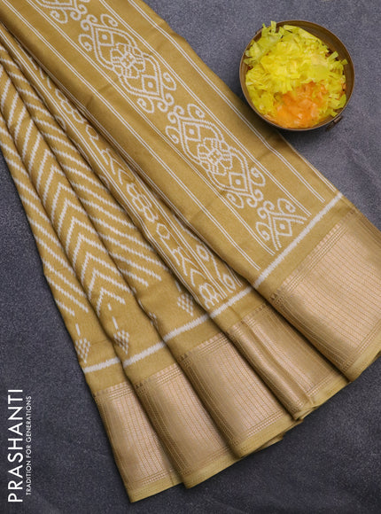 Semi dola saree mustard shade with allover zig zag ikat weaves and zari woven border