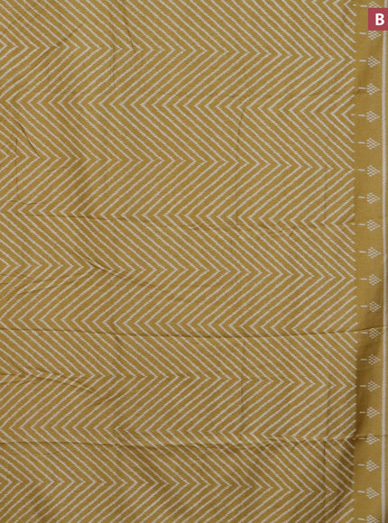 Semi dola saree mustard shade with allover zig zag ikat weaves and zari woven border