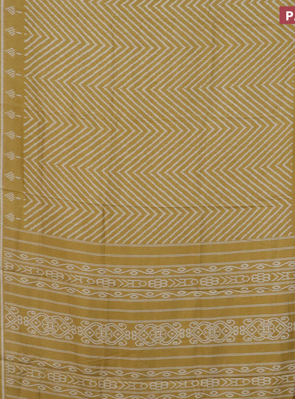 Semi dola saree mustard shade with allover zig zag ikat weaves and zari woven border