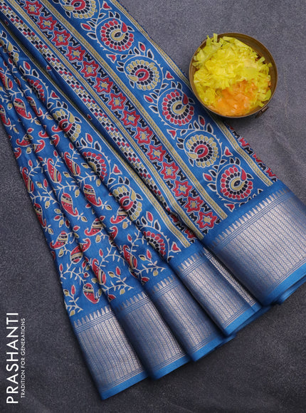 Semi dola saree cs blue with allover prints and zari woven border