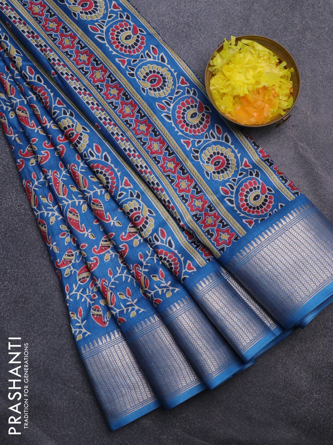 Semi dola saree cs blue with allover prints and zari woven border