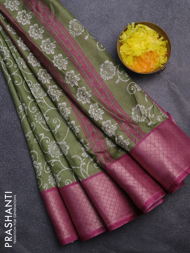 Semi dola saree pastel green and mauve pink with allover floral prints and zari woven border