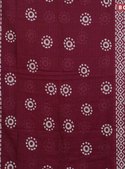 Semi dola saree wine shade with allover zari checks & batik prints and zari woven border