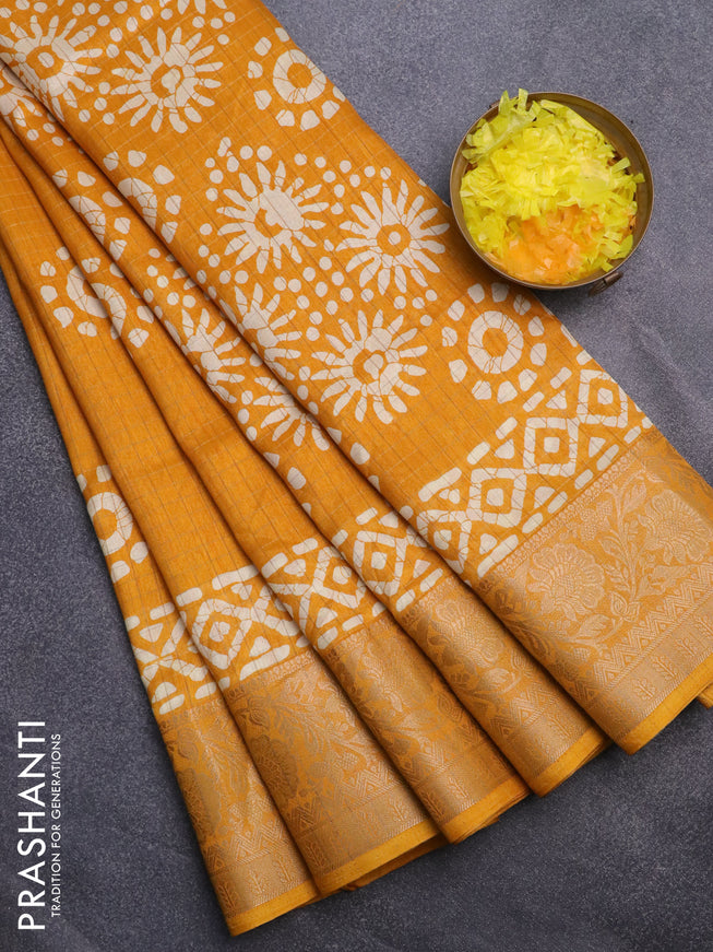 Semi dola saree mango yellow with allover zari checks & batik prints and zari woven border