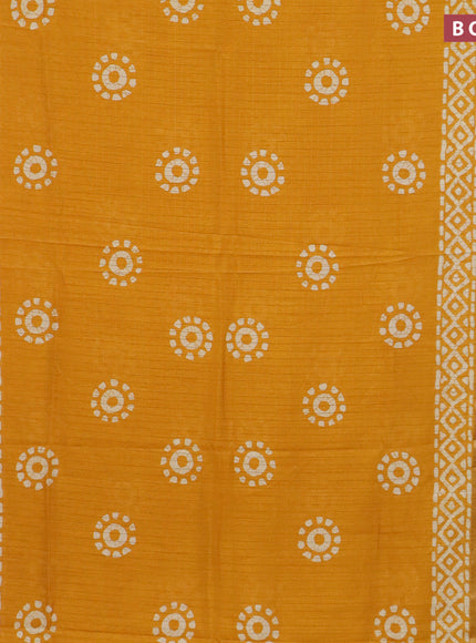 Semi dola saree mango yellow with allover zari checks & batik prints and zari woven border