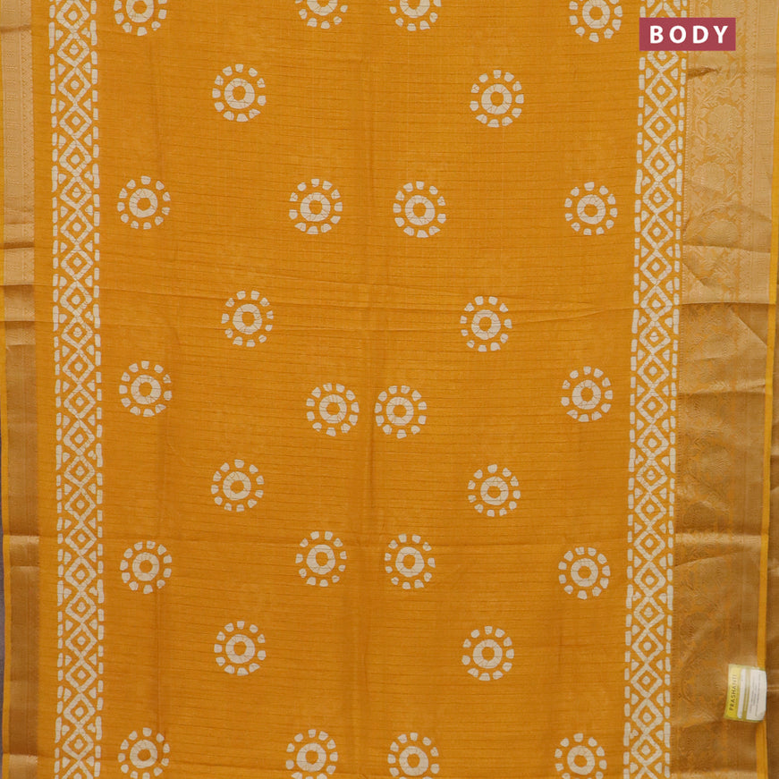 Semi dola saree mango yellow with allover zari checks & batik prints and zari woven border