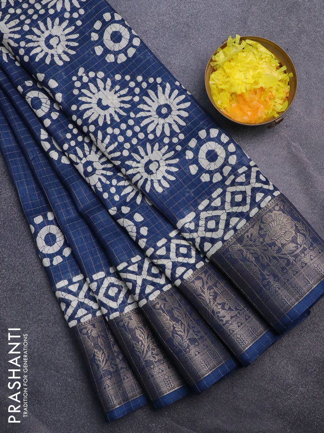 Semi dola saree blue with allover zari checks & batik prints and zari woven border