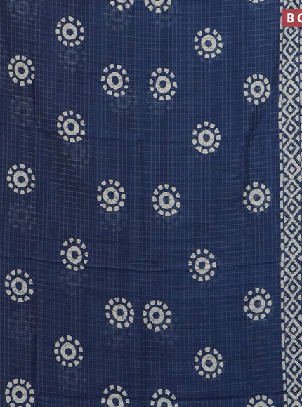 Semi dola saree blue with allover zari checks & batik prints and zari woven border