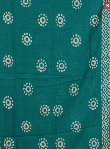 Semi dola saree teal green with allover zari checks & batik prints and zari woven border