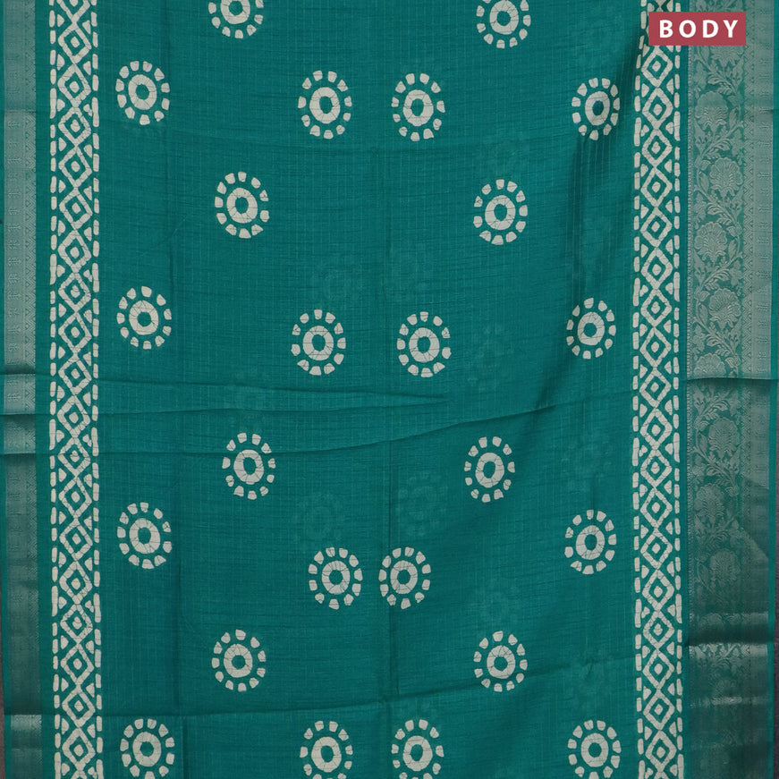 Semi dola saree teal green with allover zari checks & batik prints and zari woven border