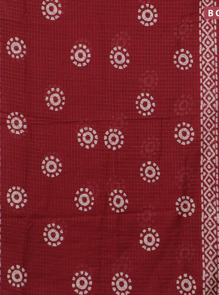 Semi dola saree maroon with allover zari checks & batik prints and zari woven border