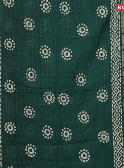 Semi dola saree green with allover zari checks & batik prints and zari woven border