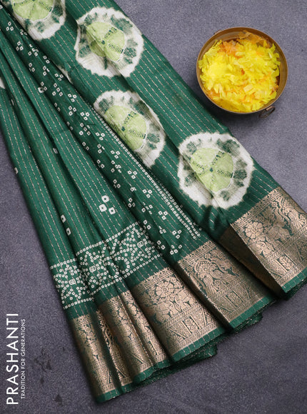 Semi dola saree green with allover zari weaves & butta prints and zari woven border