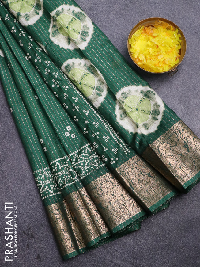 Semi dola saree green with allover zari weaves & butta prints and zari woven border