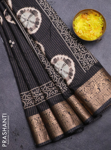 Semi dola saree black with allover zari weaves & butta prints and zari woven border