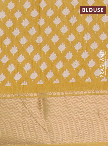 Semi dola saree yellow with allover prints and zari woven border